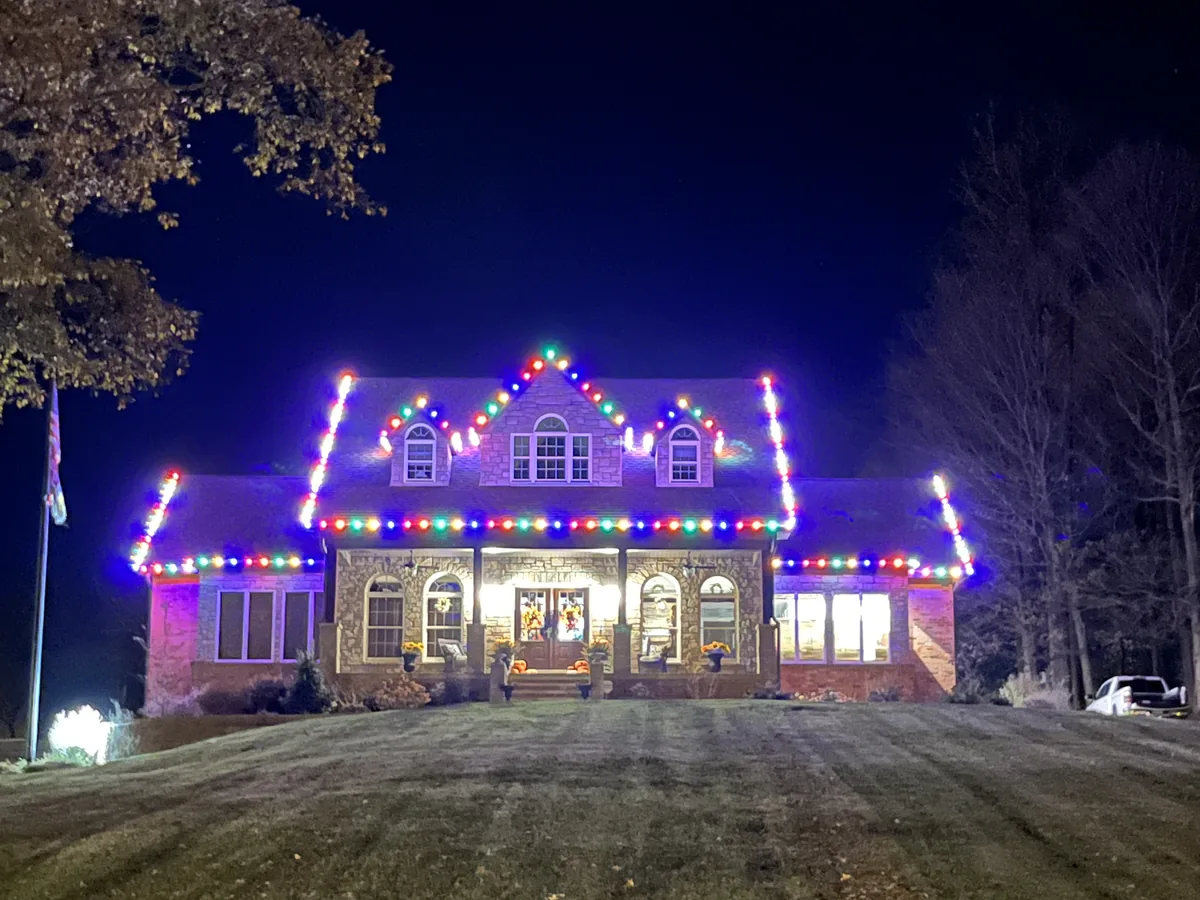Home with full roofline lighting